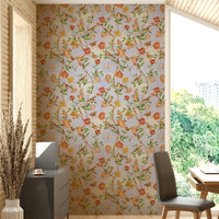 Botanical wallpaper featuring soft birds and intricate flower clusters.

