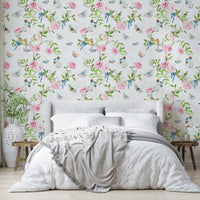 Vintage-inspired mural with garden creatures and floral trails.

