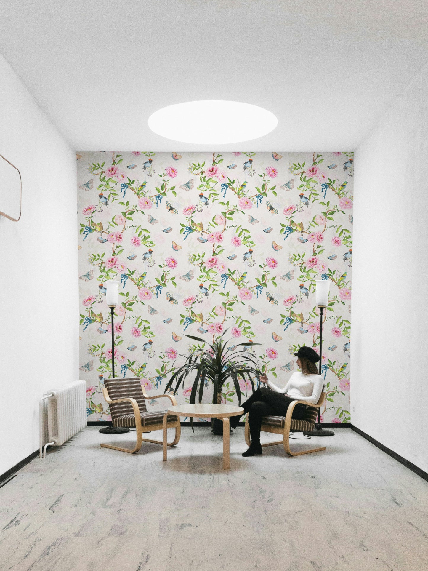Enchanted garden mural in soft pinks, greens, and neutrals.

