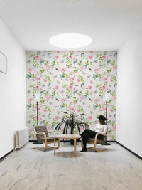 Enchanted garden mural in soft pinks, greens, and neutrals.

