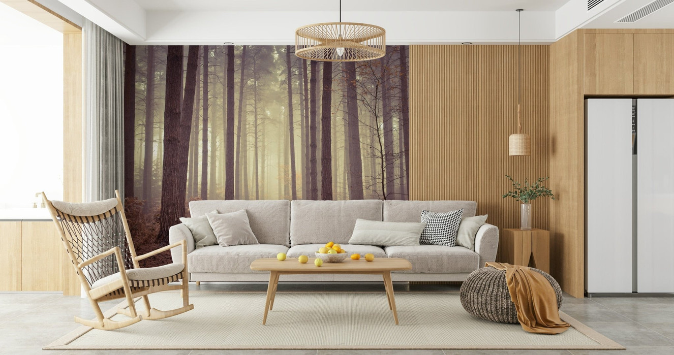 Forest wall mural behind sofa in apartment, moody woodland scene, green and gray tones
