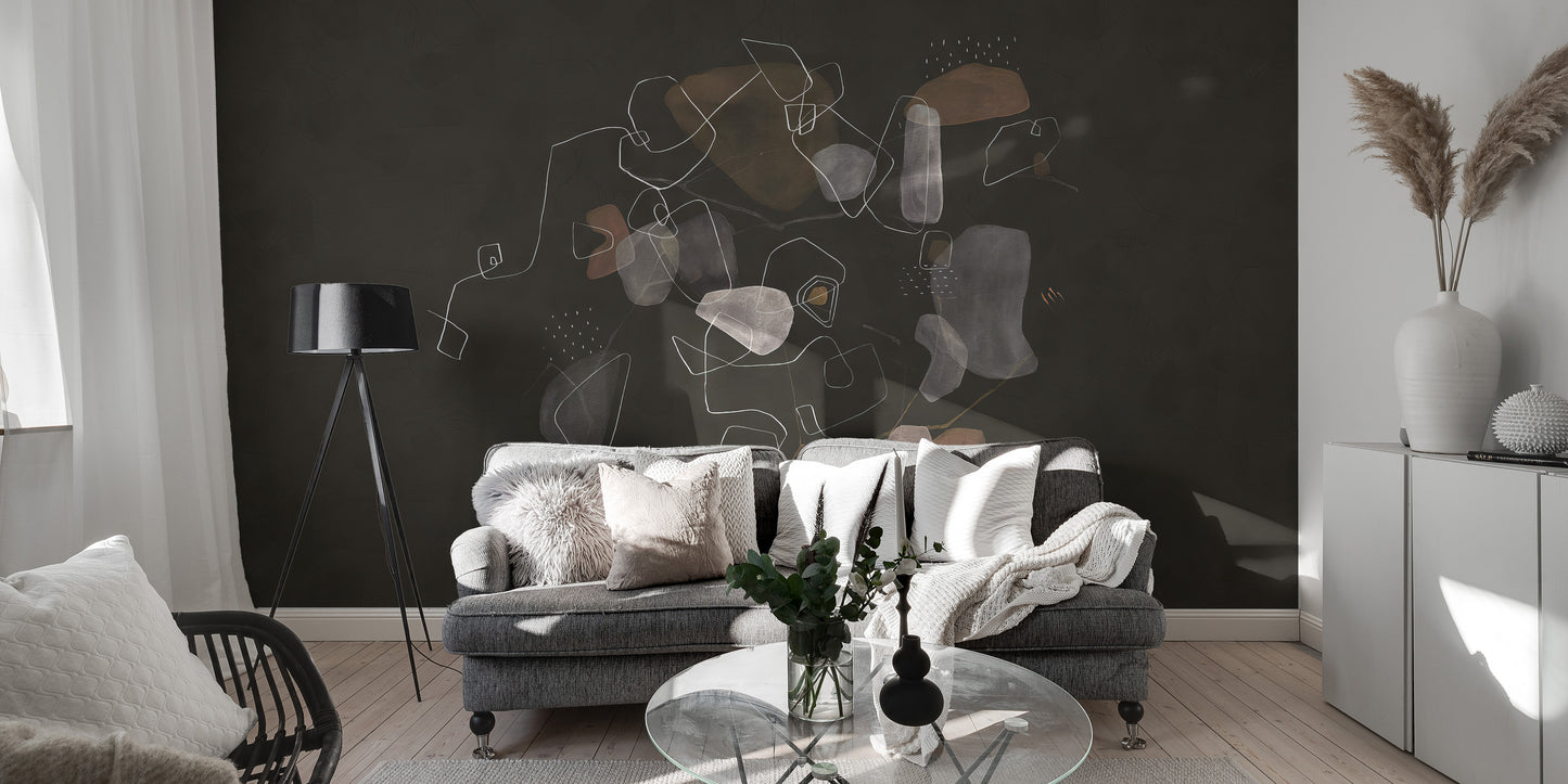 Enigmatic Cosmic wallpaper mural of muted organic shapes behind a gray sofa with a black tripod lamp in a living room