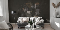 Enigmatic Cosmic wallpaper mural of muted organic shapes behind a gray sofa with a black tripod lamp in a living room