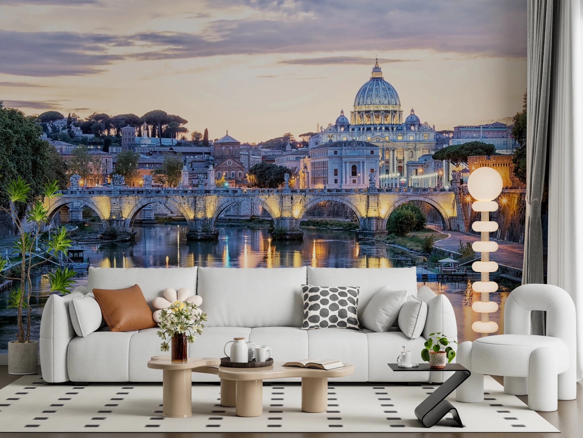 Eternal City Lights wallpaper mural of Rome at dusk above a white sofa with an orange pillow and bobble floor lamp