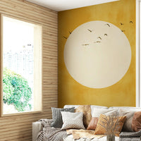 Professional home office with nature-inspired sun wall decor.