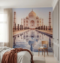 Eternal Taj wallpaper mural of the Taj Mahal and reflecting pool behind a bed and wood chair in a bedroom
