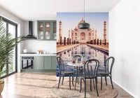 Eternal Taj wallpaper mural of the Taj Mahal beside a green kitchen with a round table and black bentwood chairs