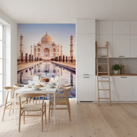 Eternal Taj wallpaper mural of the golden Taj Mahal in a white kitchen with a dining table and wishbone chairs