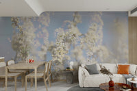 Ethereal Blossom Photography soft white floral wall mural in an open-plan room with light wood dining table and white sofa
