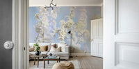 Ethereal Blossom Photography soft white floral wall mural seen through a doorway behind a white sofa and black floor lamp