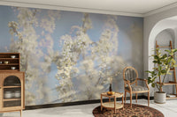 Ethereal Blossom Photography soft white floral wall mural beside a wood cabinet with a round-back chair and ladder shelf