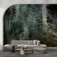 Ethereal Forest Dream wallpaper mural of deep green trees on an arched wall behind a grey sofa and ottoman