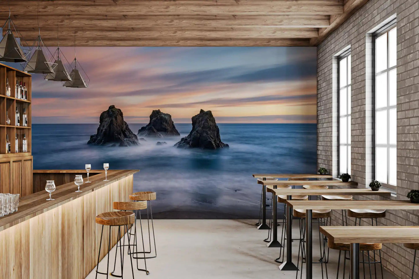 Blue coastal wall mural with sunset sky, ocean mist, and sea stacks