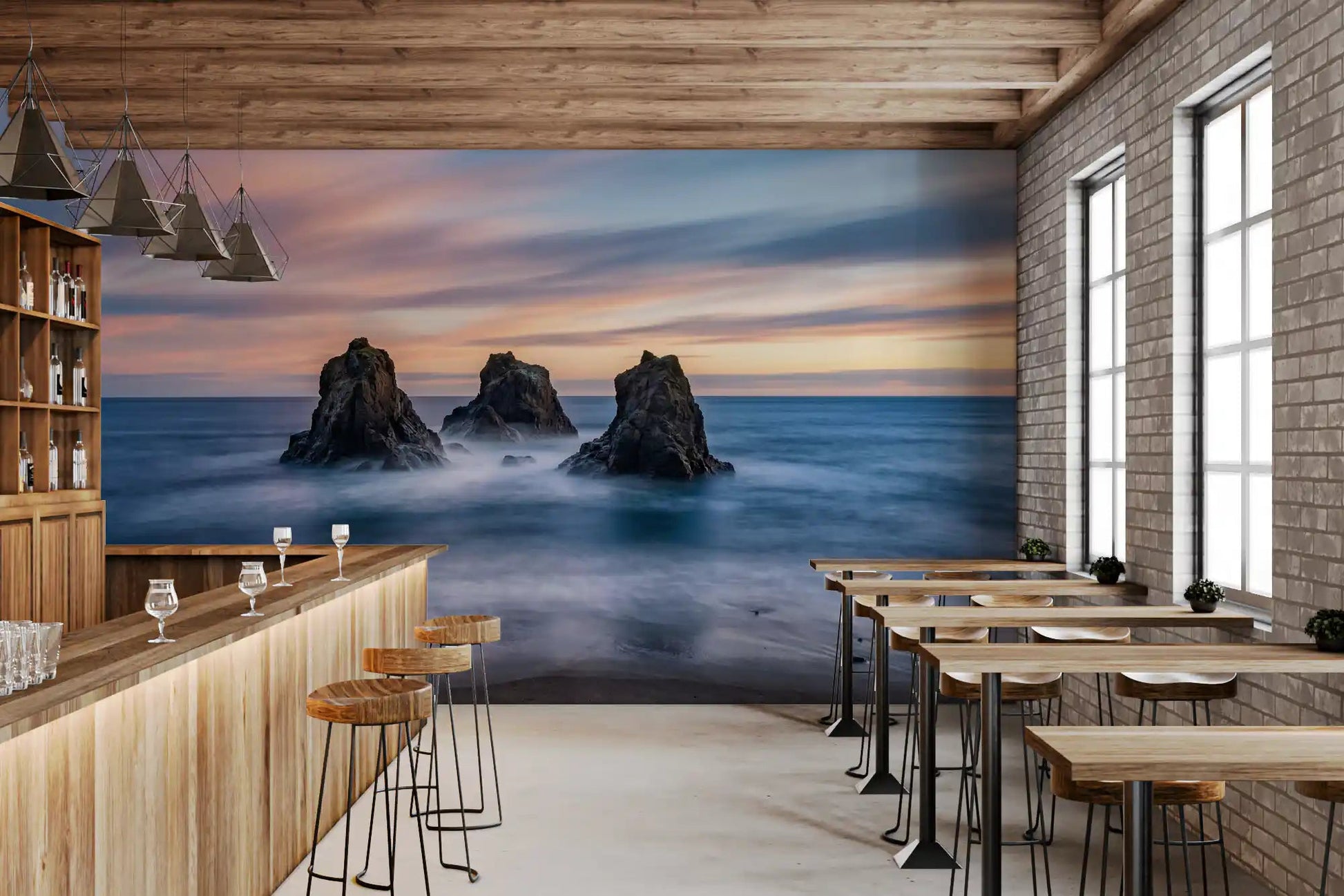 Blue coastal wall mural with sunset sky, ocean mist, and sea stacks