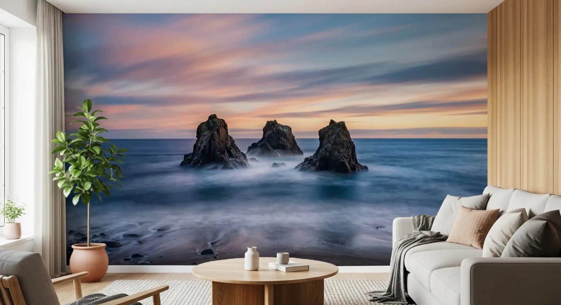 Seascape wall mural with dark sea stacks, suited to a bedroom, and soft blue water