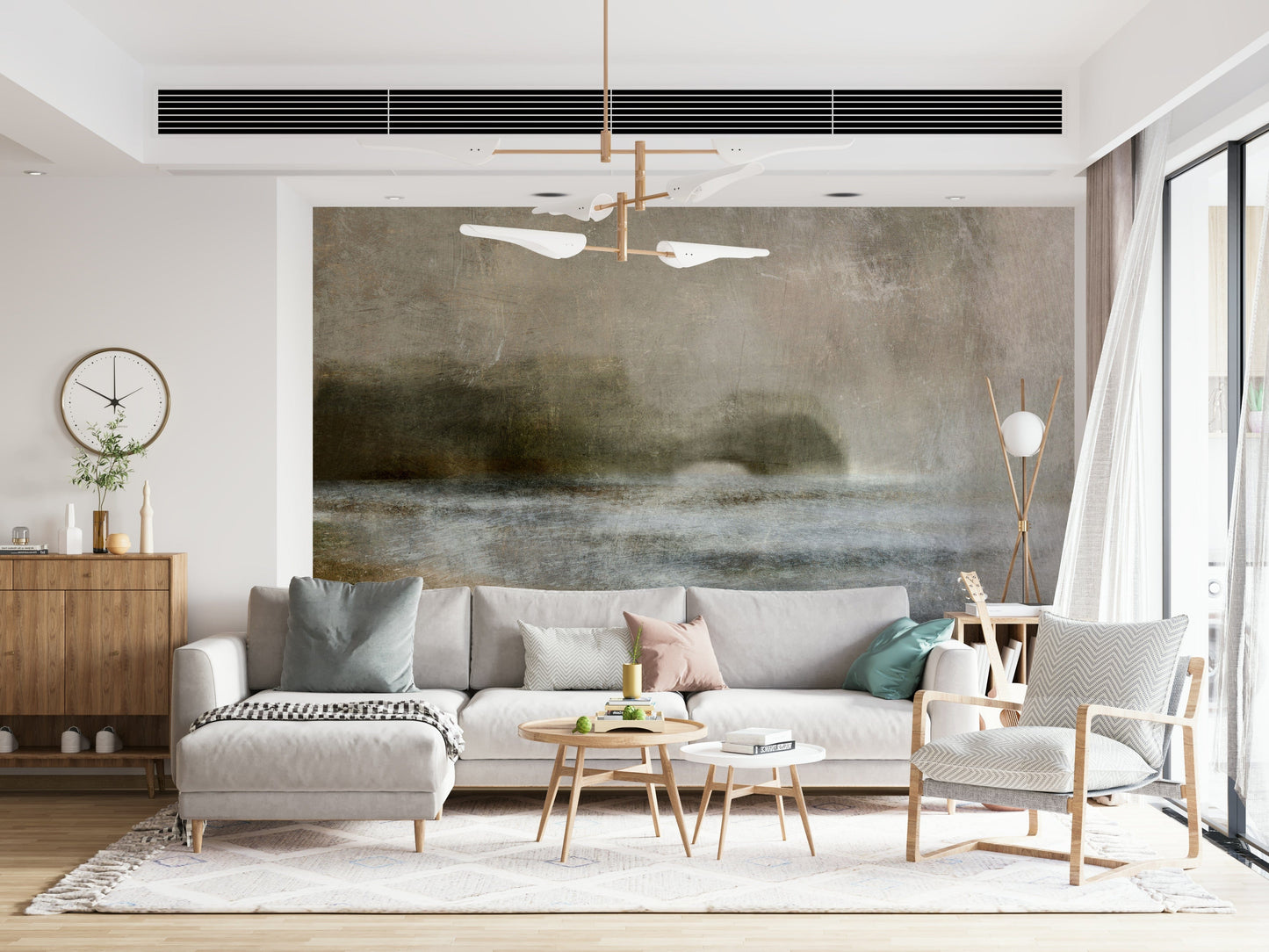 Ethereal Shoreline wallpaper mural in a living room, soft grey-and-taupe seascape behind an L-shaped sofa