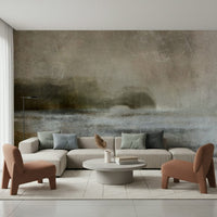 Ethereal Shoreline wallpaper mural behind a beige sectional sofa and terracotta chairs in a bright living room