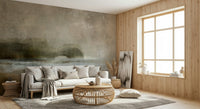 Ethereal Shoreline wallpaper mural behind a white sofa and rattan table by a wood-framed window in a living room