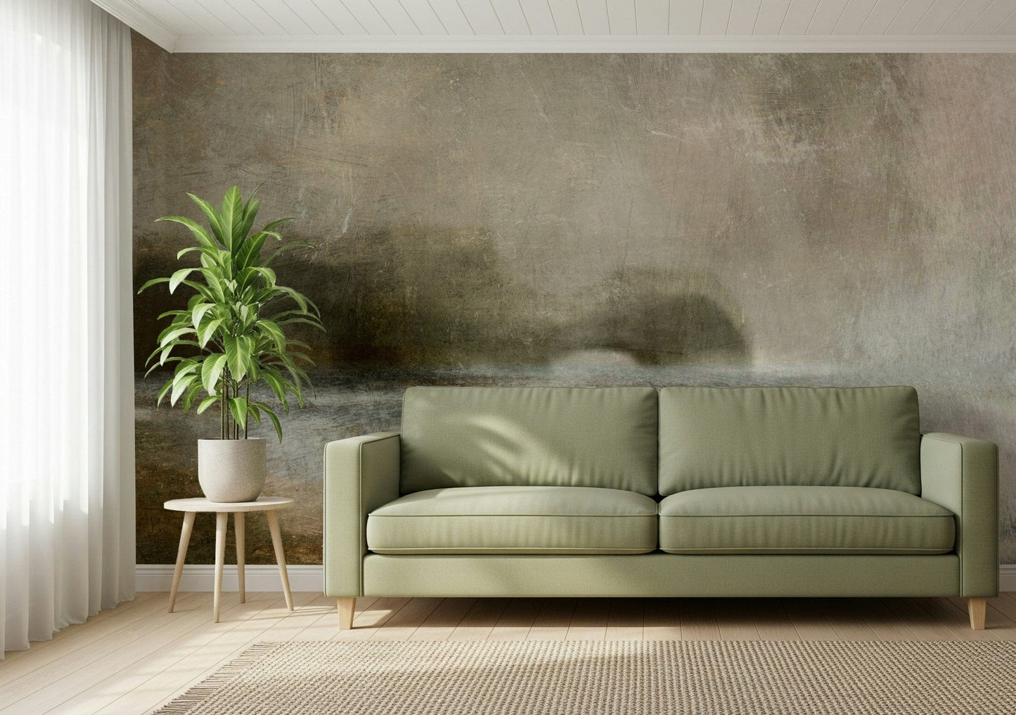 Ethereal Shoreline wallpaper mural, muted misty landscape on a wall behind a sage green sofa and potted plant