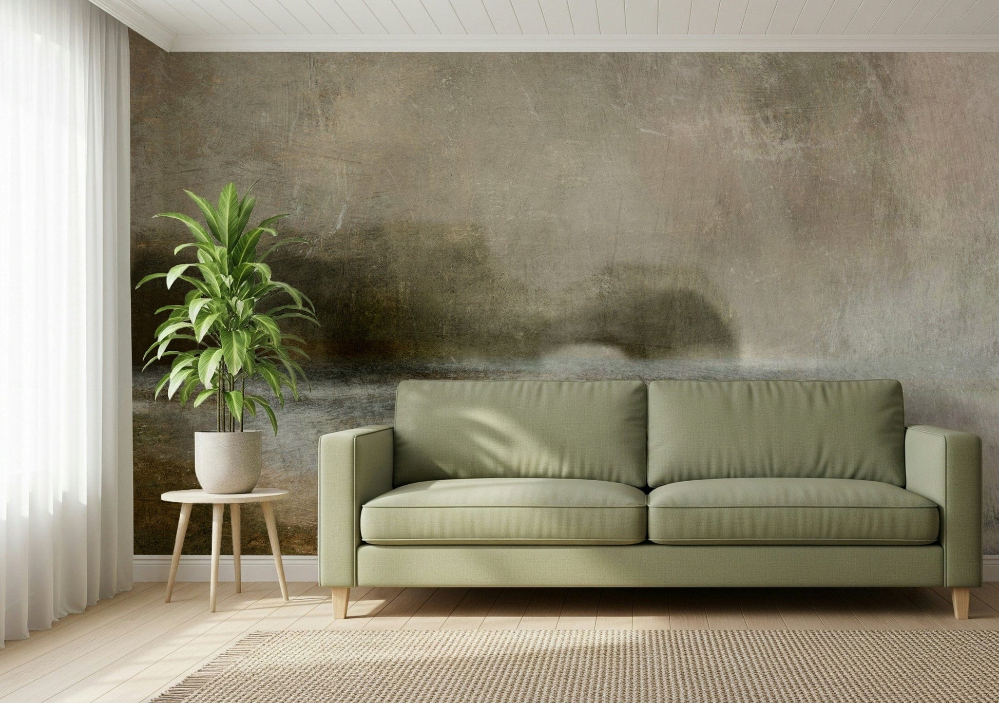 Ethereal Shoreline wallpaper mural, muted misty landscape on a wall behind a sage green sofa and potted plant