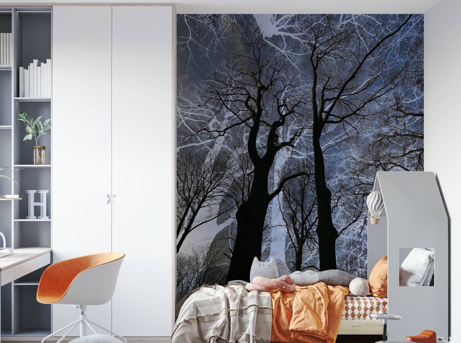 Ethereal Tree Silhouette wall mural of trees on a blue sky in a kids room with orange bedding and a desk