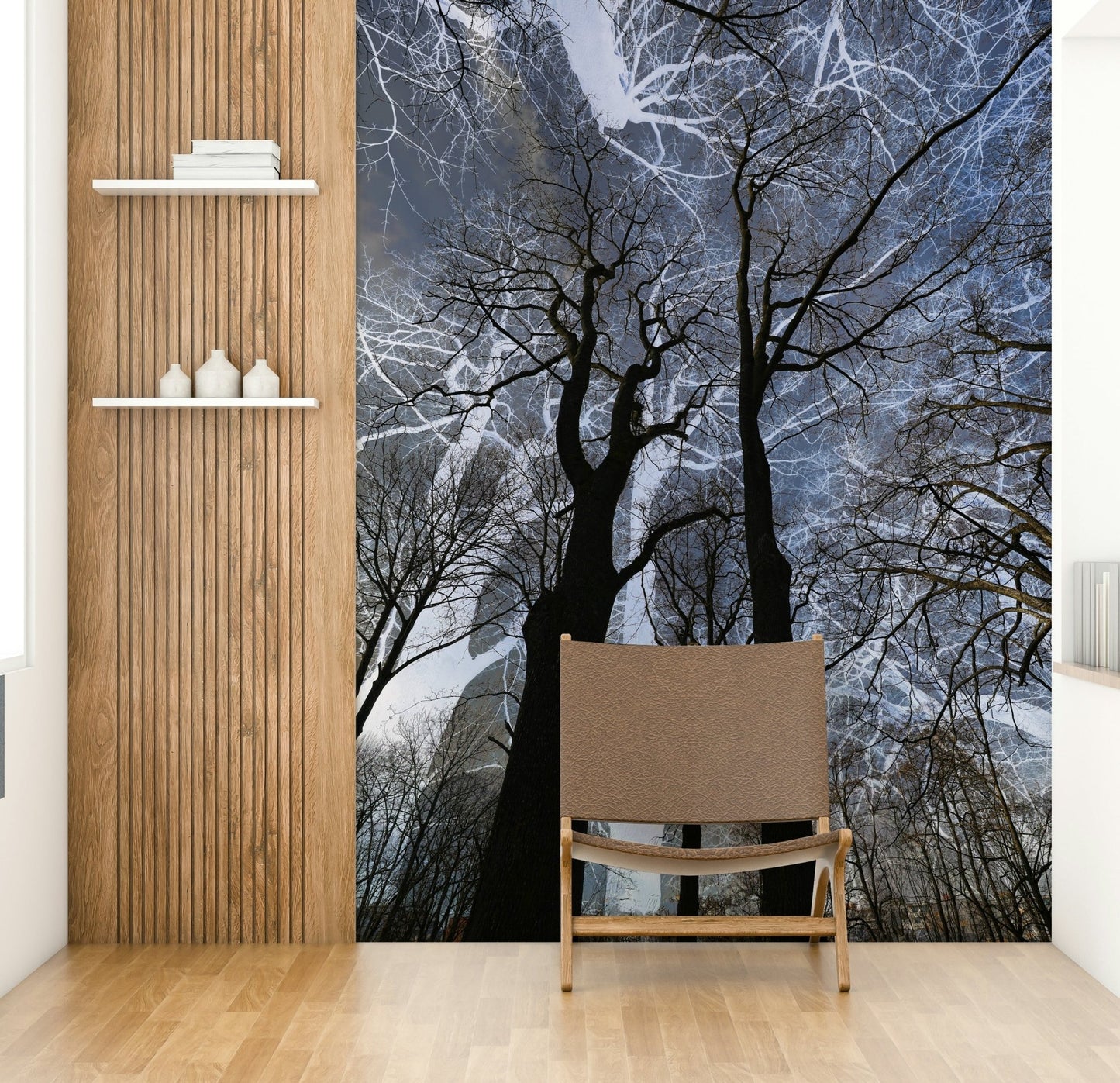 Ethereal Tree Silhouette wall mural of bare trees in a hallway beside a wood-slat wall and leather chair