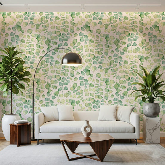 Soft sage botanical wallpaper in an apartment bedroom with neutral bedding.