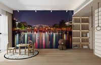 The design has a layered look, showing a long view of the canal and the buildings.

