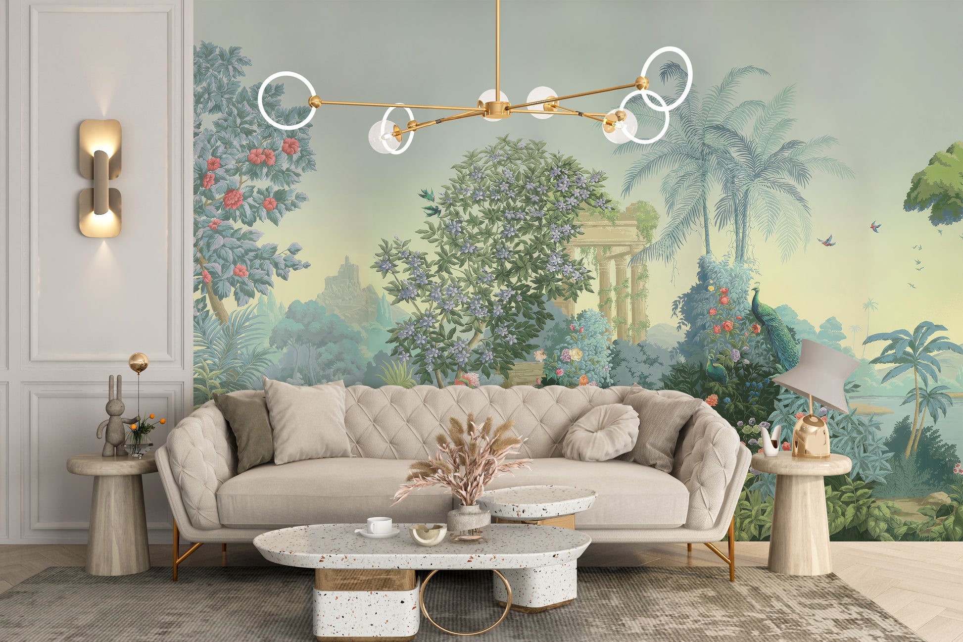 Exotic Paradise wallpaper mural of lush palms and peacocks in sage green behind a tufted cream sofa and terrazzo coffee table