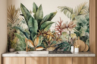 Exotic Greenery wallpaper mural of tropical foliage above a wood kitchen counter with brass tap