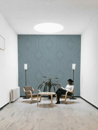 Calm interior with faded damask blue wallpaper


