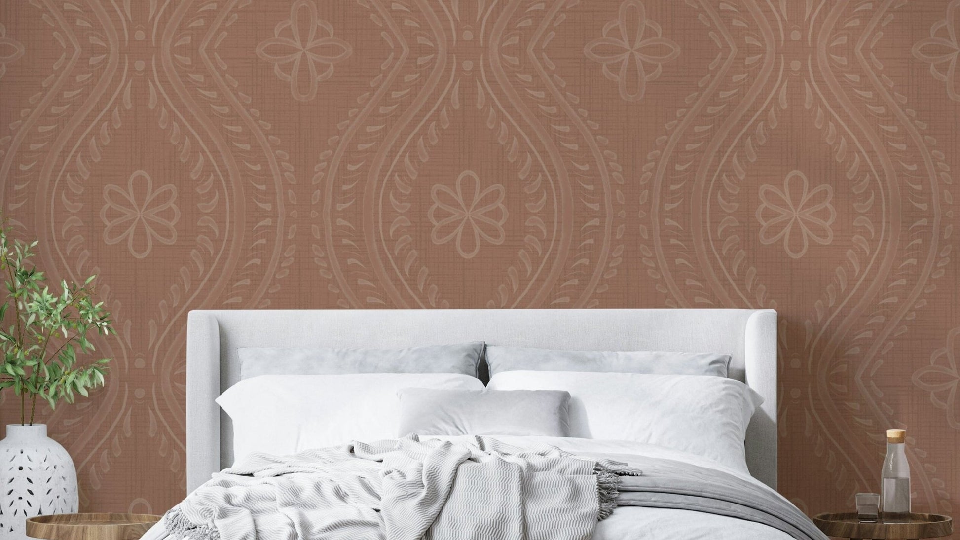 Warm-toned wallpaper with subtle ogee damask motif

