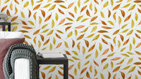Fall scattered leaves wallpaper in warm autumn colors

