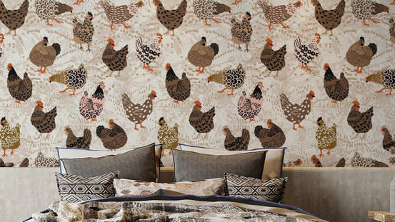 Flock of Fancy Fowl wallpaper with brown and pink illustrated hens above a grey-pillowed bed in a bedroom