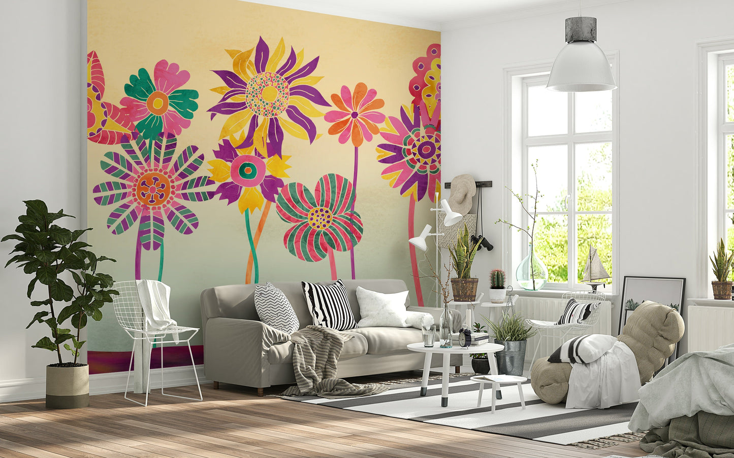 Whimsical Fantasy Flowers wallpaper mural in bright pink and yellow behind a grey sofa and white wire chair in a Scandinavian living room