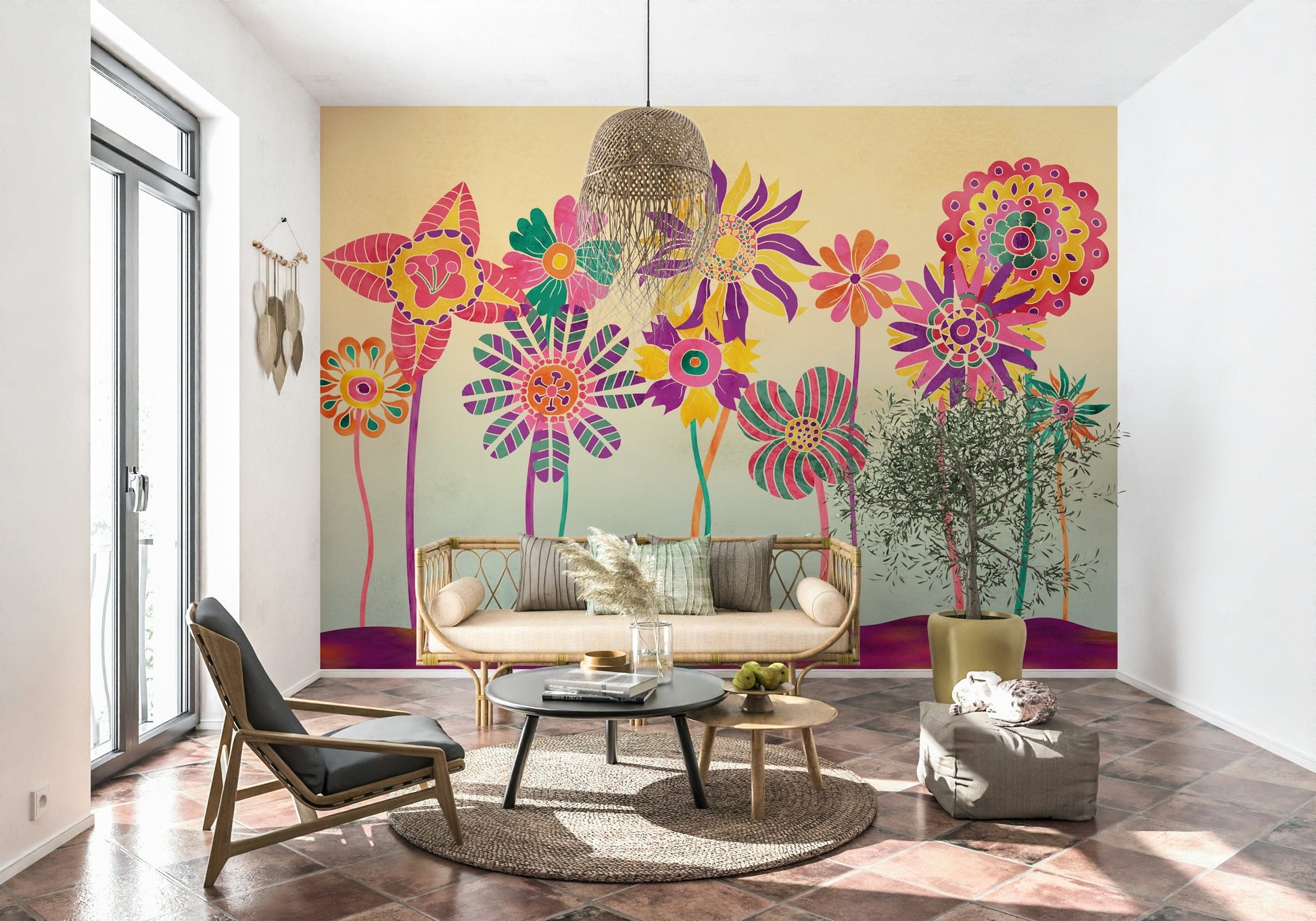 Whimsical Fantasy Flowers wallpaper mural of bold flowers behind a rattan daybed sofa and potted olive tree in a living room