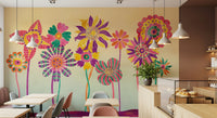 Whimsical Fantasy Flowers wallpaper mural of vivid stylized flowers behind light wood tables and chairs in a bright cafe