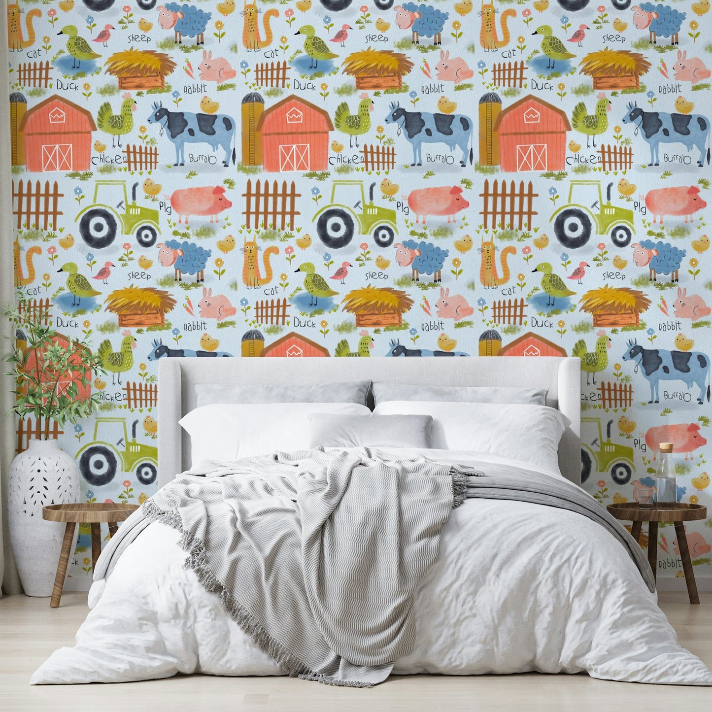 Farm Friends Fun wallpaper on a blue background behind a white bed with a grey throw in a bedroom