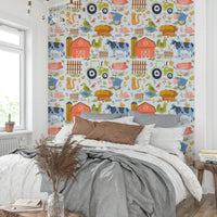 Farm Friends Fun wallpaper in a bedroom with grey and white bedding, a brown cushion and pampas grass