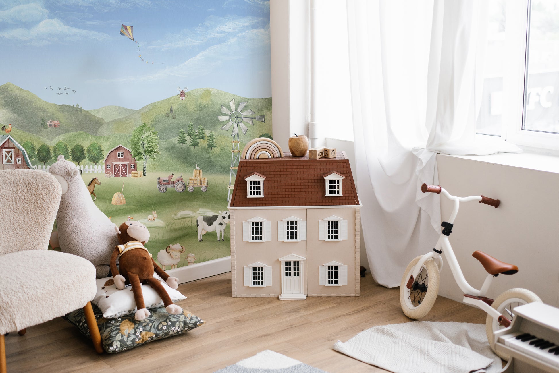 Farm Animals wallpaper with barn, horses and windmill beside a toy dollhouse in a sunlit kids room