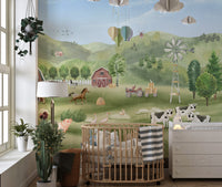 Farm Animals wallpaper with barn, horses, cows and hot-air balloons behind a round wooden crib in a nursery