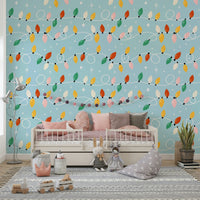 A festive wallpaper featuring colorful holiday lights strung across a soft blue background with sparkling stars.