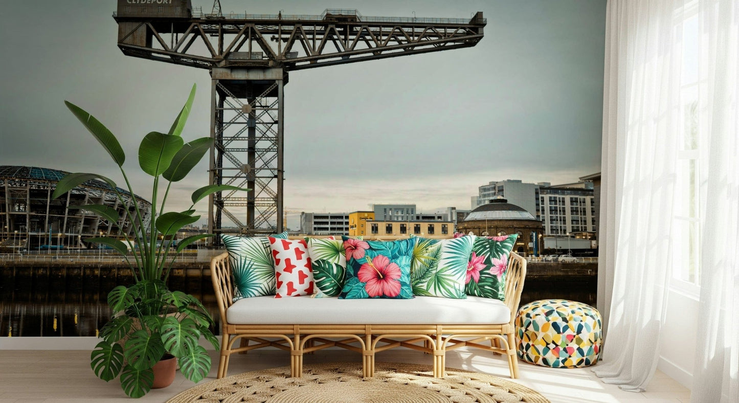 Finnieston Crane wall mural of the Glasgow quay behind a rattan sofa with bright tropical-print pillows