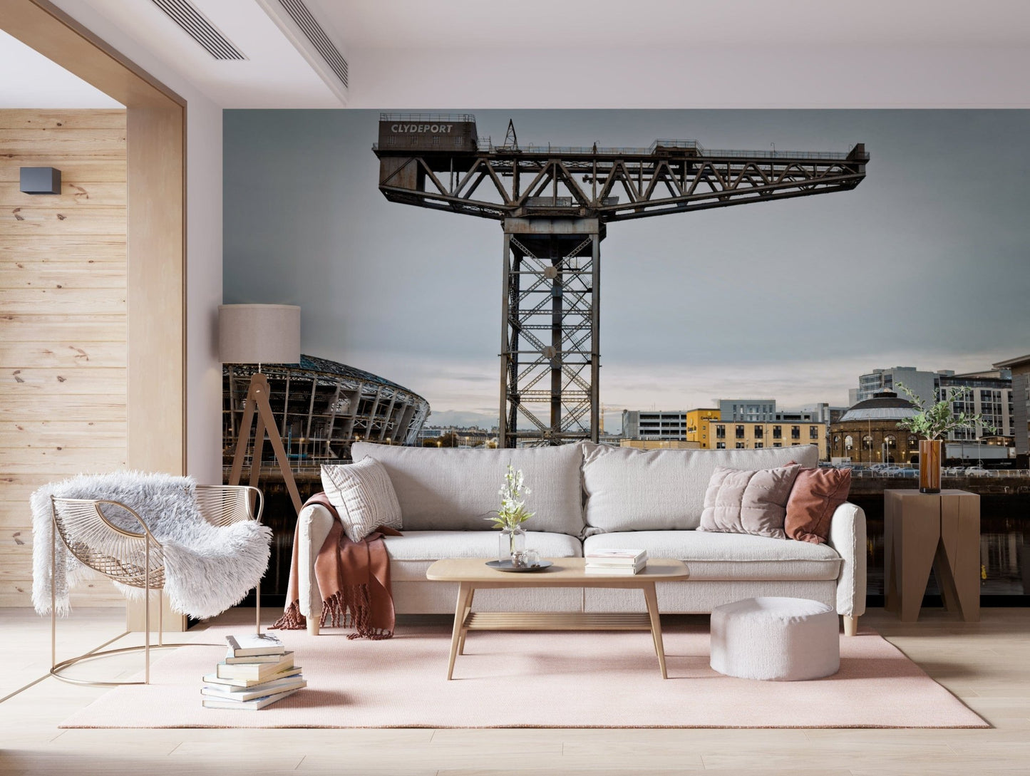 Finnieston Crane wall mural of the Clydeport crane behind a cream sofa and woven accent chair in a living room