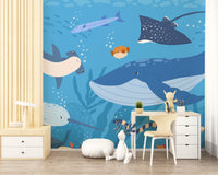 Fish and Marine Life Underwater wallpaper mural styled as a feature wall behind a dining table and chairs in blue tones