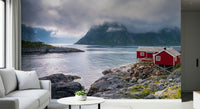 Nordic escape mural featuring rugged fjord cliffs, shimmering water, and a classic red stilt house.