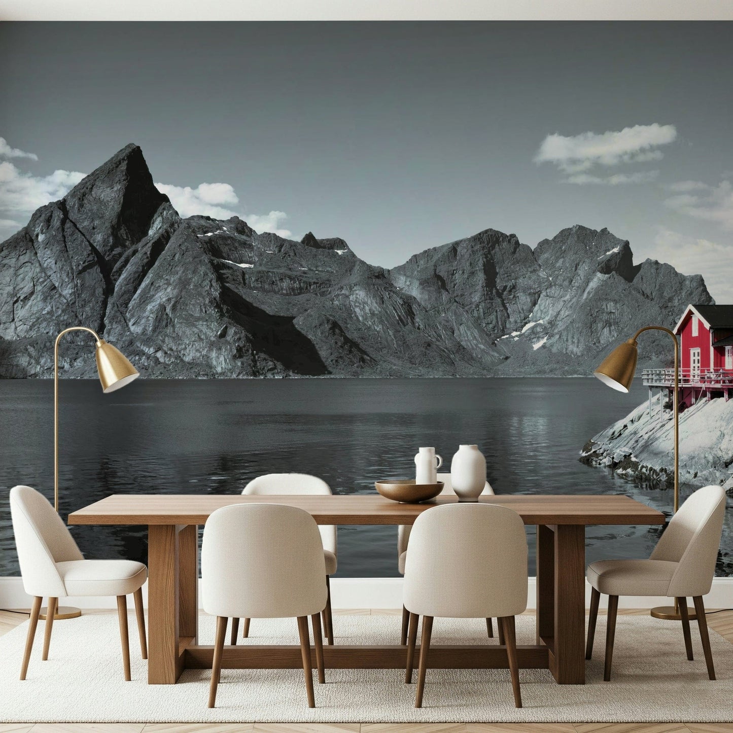 Coastal mountain mural with massive fjord cliffs and a vibrant red cabin at the water's edge.