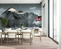 Moody Scandinavian mural featuring imposing stone mountains and a peaceful shoreline home.