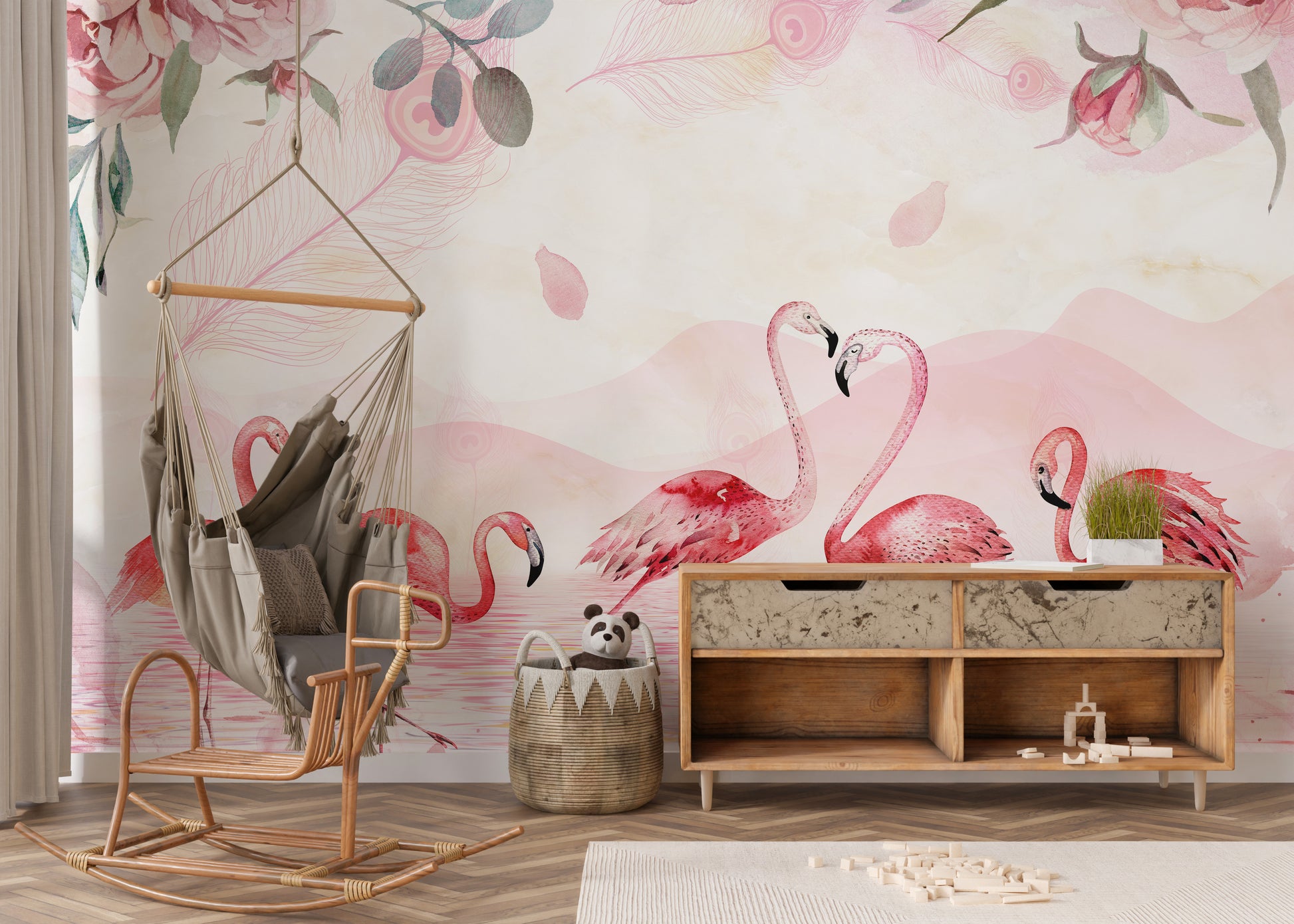 Flamingo wallpaper in pink behind a hanging hammock chair and wood sideboard in a child's playroom