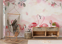 Flamingo wallpaper in pink behind a hanging hammock chair and wood sideboard in a child's playroom